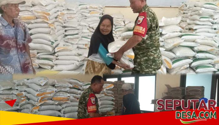 Ringankan Beban Warga, Babinsa Dampingi Distribusi Bantuan Pangan Nasional